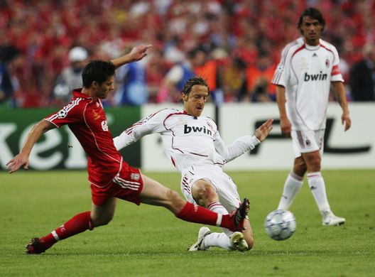 ATHENS, GREECE - MAY 23:  Xabi Alonso (L) of Liverpool competes for the ball with Massimo Ambrosini of Milan during the UEFA Champions League Final match between Liverpool and AC Milan at the Olympic Stadium on May 23, 2007 in Athens, Greece.  (Photo by Laurence Griffiths/Getty Images) 