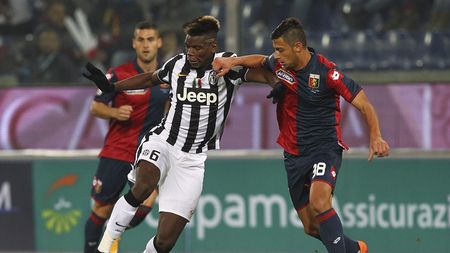 GENOA, ITALY - OCTOBER 29: Paul Pogba of Juventus FC competes for the ball with Rolando Mandragora of Genoa CFC during the Serie A match between Genoa CFC and Juventus FC at Stadio Luigi Ferraris on October 29, 2014 in Genoa, Italy. (Photo by Marco Luzzani/Getty Images)
