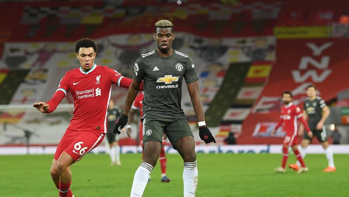 LIVERPOOL, ENGLAND - JANUARY 17: Paul Pogba of Manchester United is closed down by Trent Alexander-Arnold of Liverpool during the Premier League match between Liverpool and Manchester United at Anfield on January 17, 2021 in Liverpool, England. Sporting stadiums around England remain under strict restrictions due to the Coronavirus Pandemic as Government social distancing laws prohibit fans inside venues resulting in games being played behind closed doors. (Photo by Michael Regan/Getty Images) LIVERPOOL, ENGLAND - JANUARY 17: Paul Pogba of Manchester United is closed down by Trent Alexander-Arnold of Liverpool during the Premier League match between Liverpool and Manchester United at Anfield on January 17, 2021 in Liverpool, England. Sporting stadiums around England remain under strict restrictions due to the Coronavirus Pandemic as Government social distancing laws prohibit fans inside venues resulting in games being played behind closed doors. (Photo by Michael Regan/Getty Images)