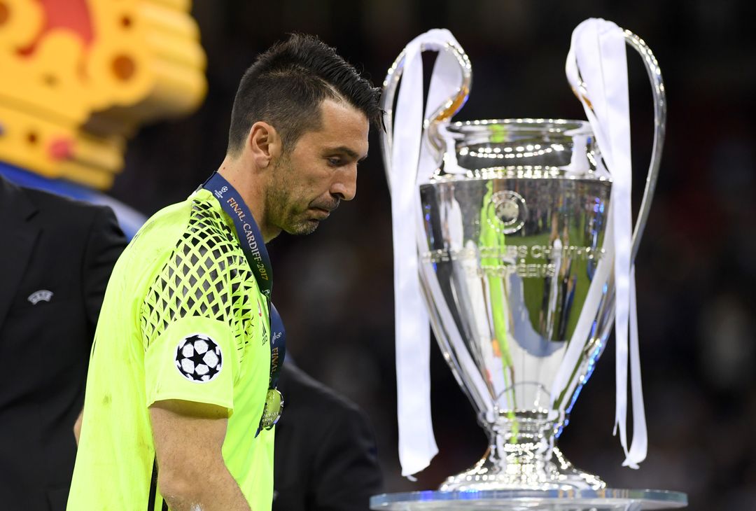  CARDIFF, WALES - JUNE 03:  Gianluigi Buffon of Juventus walks past the Champions League trophy after the UEFA Champions League Final between Juventus and Real Madrid at National Stadium of Wales on June 3, 2017 in Cardiff, Wales.  (Photo by Matthias Hangst/Getty Images) 