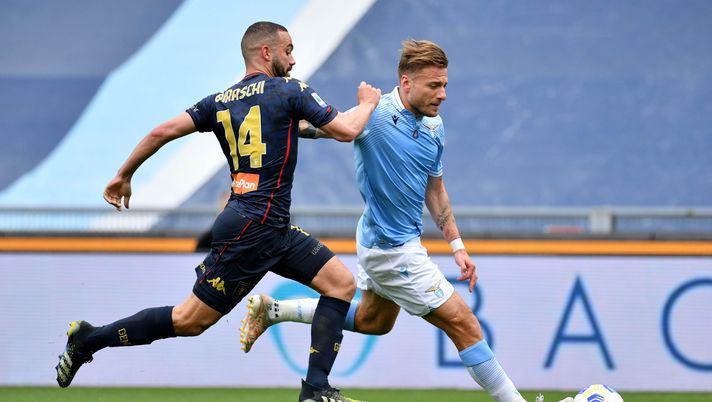 ROME, ITALY - MAY 02: Ciro Immobile of SS Lazio compete for the ball with Davide Biraschi of Genoa CFC during the Serie A match between SS Lazio and Genoa CFC at Stadio Olimpico on May 02, 2021 in Rome, Italy. Sporting stadiums around Italy remain under strict restrictions due to the Coronavirus Pandemic as Government social distancing laws prohibit fans inside venues resulting in games being played behind closed doors. (Photo by Marco Rosi - SS Lazio/Getty Images) ROME, ITALY - MAY 02: Ciro Immobile of SS Lazio compete for the ball with Davide Biraschi of Genoa CFC during the Serie A match between SS Lazio and Genoa CFC at Stadio Olimpico on May 02, 2021 in Rome, Italy. Sporting stadiums around Italy remain under strict restrictions due to the Coronavirus Pandemic as Government social distancing laws prohibit fans inside venues resulting in games being played behind closed doors. (Photo by Marco Rosi - SS Lazio/Getty Images)
