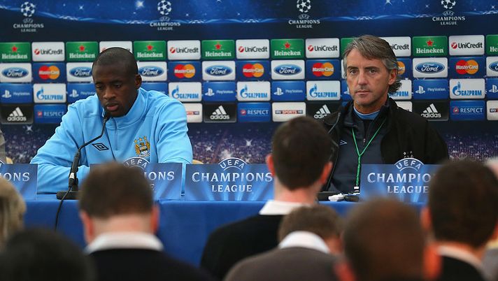 MANCHESTER, ENGLAND - OCTOBER 02:  Yaya Toure of Manchester City and Roberto Mancini the manager of Manchester City face the media during a press conference at the Carrington Training Ground on October 2, 2012 in Manchester, England.  (Photo by Alex Livesey/Getty Images) 