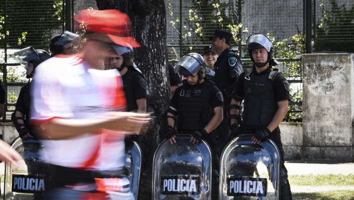 BUENOS AIRES, ARGENTINA - NOVEMBER 25: Riot police stand guard outside of Monumental Stadium before the second leg of the final of Copa CONMEBOL Libertadores 2018 between River Plate and Boca Juniors at Estadio Monumental Antonio Vespucio Liberti on November 25, 2018 in Buenos Aires, Argentina. The match was postponed again today due to the attacks suffered by players of Boca Juniors on their arrival to the stadium yesterday. (Photo by Marcelo Endelli/Getty Images) BUENOS AIRES, ARGENTINA - NOVEMBER 25: Riot police stand guard outside of Monumental Stadium before the second leg of the final of Copa CONMEBOL Libertadores 2018 between River Plate and Boca Juniors at Estadio Monumental Antonio Vespucio Liberti on November 25, 2018 in Buenos Aires, Argentina. The match was postponed again today due to the attacks suffered by players of Boca Juniors on their arrival to the stadium yesterday. (Photo by Marcelo Endelli/Getty Images)