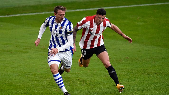 BILBAO, SPAIN - DECEMBER 31: Nacho Monreal of Real Sociedad tackles Ander Capa of Athletico Club during the La Liga Santander match between Athletic Club and Real Sociedad at Estadio de San Mames on December 31, 2020 in Bilbao, Spain. Sporting stadiums around Spain remain under strict restrictions due to the Coronavirus Pandemic as Government social distancing laws prohibit fans inside venues resulting in games being played behind closed doors. (Photo by Juan Manuel Serrano Arce/Getty Images) BILBAO, SPAIN - DECEMBER 31: Nacho Monreal of Real Sociedad tackles Ander Capa of Athletico Club during the La Liga Santander match between Athletic Club and Real Sociedad at Estadio de San Mames on December 31, 2020 in Bilbao, Spain. Sporting stadiums around Spain remain under strict restrictions due to the Coronavirus Pandemic as Government social distancing laws prohibit fans inside venues resulting in games being played behind closed doors. (Photo by Juan Manuel Serrano Arce/Getty Images)