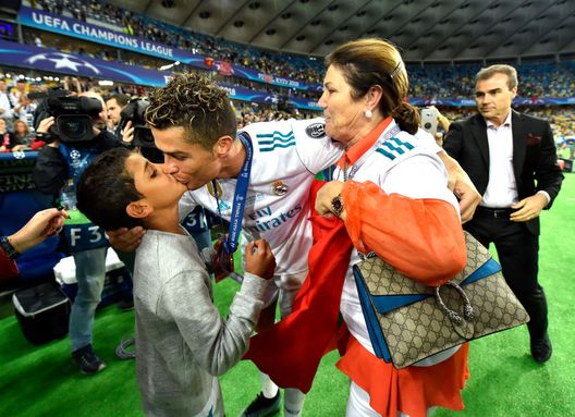 KIEV, UKRAINE - MAY 26: Cristiano Ronaldo of Real Madrid celebrates with his family following his sides victory in the UEFA Champions League Final between Real Madrid and Liverpool at NSC Olimpiyskiy Stadium on May 26, 2018 in Kiev, Ukraine. (Photo by David Ramos/Getty Images) KIEV, UKRAINE - MAY 26: Cristiano Ronaldo of Real Madrid celebrates with his family following his sides victory in the UEFA Champions League Final between Real Madrid and Liverpool at NSC Olimpiyskiy Stadium on May 26, 2018 in Kiev, Ukraine. (Photo by David Ramos/Getty Images)
