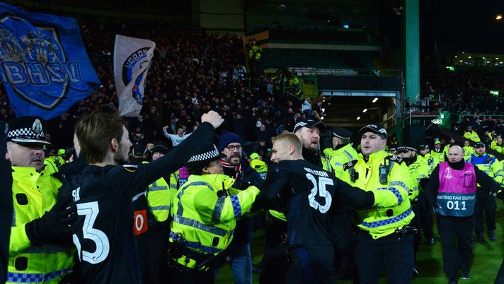 GLASGOW, SCOTLAND - FEBRUARY 27: Rasmus Falk and Victor Nelson of FC Kobenhavn are help back by officers from police Scotland as they try to celebrate with the fans during the UEFA Europa League round of 32 second leg match between Celtic FC and FC Kobenhavn at Celtic Park on February 27, 2020 in Glasgow, United Kingdom. (Photo by Mark Runnacles/Getty Images) GLASGOW, SCOTLAND - FEBRUARY 27: Rasmus Falk and Victor Nelson of FC Kobenhavn are help back by officers from police Scotland as they try to celebrate with the fans during the UEFA Europa League round of 32 second leg match between Celtic FC and FC Kobenhavn at Celtic Park on February 27, 2020 in Glasgow, United Kingdom. (Photo by Mark Runnacles/Getty Images)