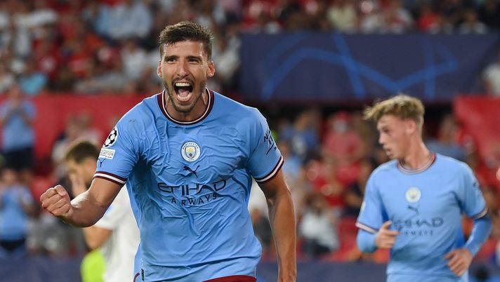 SEVILLE, SPAIN - SEPTEMBER 06: Ruben Dias of Manchester City celebrates after scoring their side's fourth goal during the UEFA Champions League group G match between Sevilla FC and Manchester City at Estadio Ramon Sanchez Pizjuan on September 06, 2022 in Seville, Spain. (Photo by David Ramos/Getty Images) Champions League