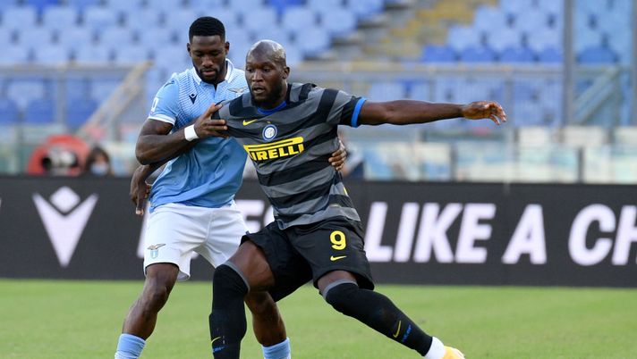 ROME, ITALY - OCTOBER 04: Quissanga Bastos of SS Lazio compete for the ball with Romelu Lukaku of FC Internazionale during the Serie A match between SS Lazio and FC Internazionale at Stadio Olimpico on October 04, 2020 in Rome, Italy. (Photo by Marco Rosi - SS Lazio/Getty Images) ROME, ITALY - OCTOBER 04: Quissanga Bastos of SS Lazio compete for the ball with Romelu Lukaku of FC Internazionale during the Serie A match between SS Lazio and FC Internazionale at Stadio Olimpico on October 04, 2020 in Rome, Italy. (Photo by Marco Rosi - SS Lazio/Getty Images)