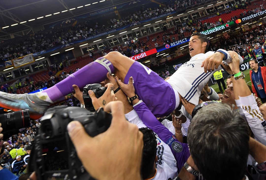  CARDIFF, WALES - JUNE 03:  Cristiano Ronaldo of Real Madrid is thrown into the air by his Real Madrid team mates after the UEFA Champions League Final between Juventus and Real Madrid at National Stadium of Wales on June 3, 2017 in Cardiff, Wales.  (Photo by David Ramos/Getty Images) 