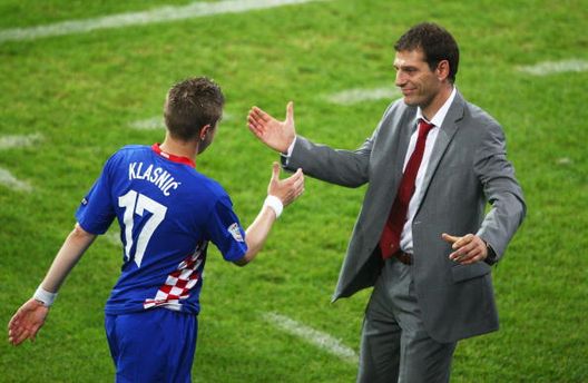 KLAGENFURT, AUSTRIA - JUNE 16: Croatia's head coach Slaven Bilic (R) congratulates Ivan Clasnic after he was substituted after scoring the opening goal during the UEFA EURO 2008 Group B match between Poland and Croatia at Worthersee Stadion on June 16, 2008 in Klagenfurt, Austria. (Photo by Christof Koepsel/Bongarts/Getty Images) KLAGENFURT, AUSTRIA - JUNE 16: Croatia's head coach Slaven Bilic (R) congratulates Ivan Clasnic after he was substituted after scoring the opening goal during the UEFA EURO 2008 Group B match between Poland and Croatia at Worthersee Stadion on June 16, 2008 in Klagenfurt, Austria. (Photo by Christof Koepsel/Bongarts/Getty Images)