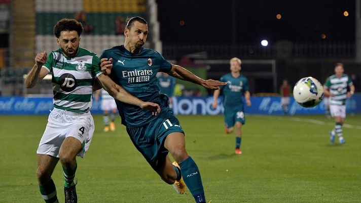 TALLAGHT, IRELAND - SEPTEMBER 17: Zlatan Ibrahimovic of AC Milan battles for possession with Roberto Lopes of Shamrock Rovers during the UEFA Europa League second qualifying round match between Shamrock Rovers and AC Milan at Tallaght Stadium on September 17, 2020 in Tallaght, Ireland. (Photo by Charles McQuillan/Getty Images) TALLAGHT, IRELAND - SEPTEMBER 17: Zlatan Ibrahimovic of AC Milan battles for possession with Roberto Lopes of Shamrock Rovers during the UEFA Europa League second qualifying round match between Shamrock Rovers and AC Milan at Tallaght Stadium on September 17, 2020 in Tallaght, Ireland. (Photo by Charles McQuillan/Getty Images)
