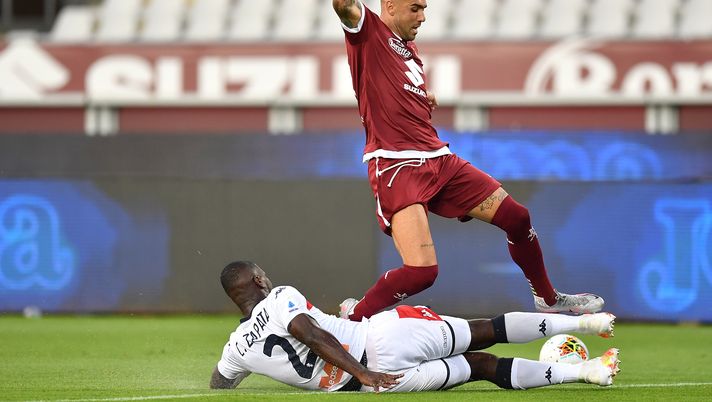 TURIN, ITALY - JULY 16:  Simone Zaza (R) of Torino FC is tackled by Christian Zapata of Genoa CFC during the Serie A match between Torino FC and  Genoa CFC at Stadio Olimpico di Torino on July 16, 2020 in Turin, Italy.  (Photo by Valerio Pennicino/Getty Images) 