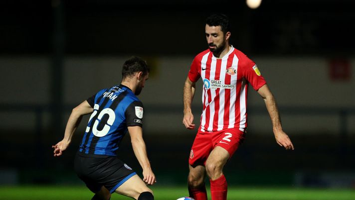 ROCHDALE, ENGLAND - OCTOBER 27: Conor McLaughlin of Sunderland battles for possession with Jimmy Ryan of Rochdale during the Sky Bet League One match between Rochdale and Sunderland at Crown Oil Arena on October 27, 2020 in Rochdale, England. Sporting stadiums around the UK remain under strict restrictions due to the Coronavirus Pandemic as Government social distancing laws prohibit fans inside venues resulting in games being played behind closed doors. (Photo by Lewis Storey/Getty Images) ROCHDALE, ENGLAND - OCTOBER 27: Conor McLaughlin of Sunderland battles for possession with Jimmy Ryan of Rochdale during the Sky Bet League One match between Rochdale and Sunderland at Crown Oil Arena on October 27, 2020 in Rochdale, England. Sporting stadiums around the UK remain under strict restrictions due to the Coronavirus Pandemic as Government social distancing laws prohibit fans inside venues resulting in games being played behind closed doors. (Photo by Lewis Storey/Getty Images)