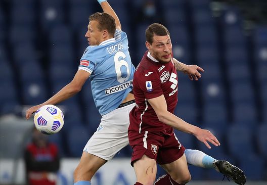 ROME, ITALY - MAY 18: Lucas Leiva of S.S. Lazio challenges for the high ball with Andrea Belotti of Torino FC during the Serie A match between SS Lazio and Torino FC at Stadio Olimpico on May 18, 2021 in Rome, Italy. Sporting stadiums around Italy remain under strict restrictions due to the Coronavirus Pandemic as Government social distancing laws prohibit fans inside venues resulting in games being played behind closed doors. (Photo by Paolo Bruno/Getty Images) ROME, ITALY - MAY 18: Lucas Leiva of S.S. Lazio challenges for the high ball with Andrea Belotti of Torino FC during the Serie A match between SS Lazio and Torino FC at Stadio Olimpico on May 18, 2021 in Rome, Italy. Sporting stadiums around Italy remain under strict restrictions due to the Coronavirus Pandemic as Government social distancing laws prohibit fans inside venues resulting in games being played behind closed doors. (Photo by Paolo Bruno/Getty Images)