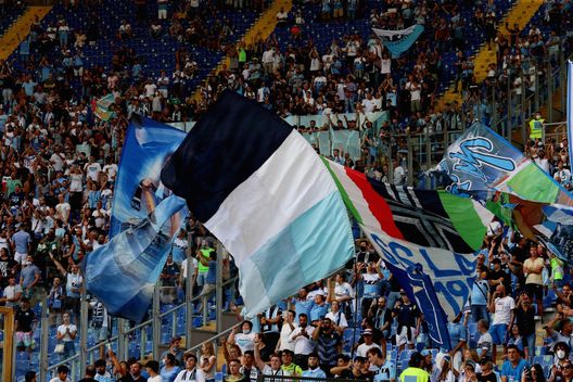 ROME, ITALY - AUGUST 28: SS Lazio fans support their team before the Serie A match between SS Lazio and Spezia Calcio at Stadio Olimpico on August 28, 2021 in Rome, Italy. (Photo by Paolo Bruno/Getty Images) ROME, ITALY - AUGUST 28: SS Lazio fans support their team before the Serie A match between SS Lazio and Spezia Calcio at Stadio Olimpico on August 28, 2021 in Rome, Italy. (Photo by Paolo Bruno/Getty Images)