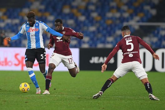 NAPLES, ITALY - DECEMBER 23: Tiemoue Bakayoko of S.S.C. Napoli battles for possession with Wilfried Singo of Torino F.C. during the Serie A match between SSC Napoli and Torino FC at Stadio Diego Armando Maradona on December 23, 2020 in Naples, Italy. Sporting stadiums around Italy remain under strict restrictions due to the Coronavirus Pandemic as Government social distancing laws prohibit fans inside venues resulting in games being played behind closed doors. (Photo by Francesco Pecoraro/Getty Images) NAPLES, ITALY - DECEMBER 23: Tiemoue Bakayoko of S.S.C. Napoli battles for possession with Wilfried Singo of Torino F.C. during the Serie A match between SSC Napoli and Torino FC at Stadio Diego Armando Maradona on December 23, 2020 in Naples, Italy. Sporting stadiums around Italy remain under strict restrictions due to the Coronavirus Pandemic as Government social distancing laws prohibit fans inside venues resulting in games being played behind closed doors. (Photo by Francesco Pecoraro/Getty Images)