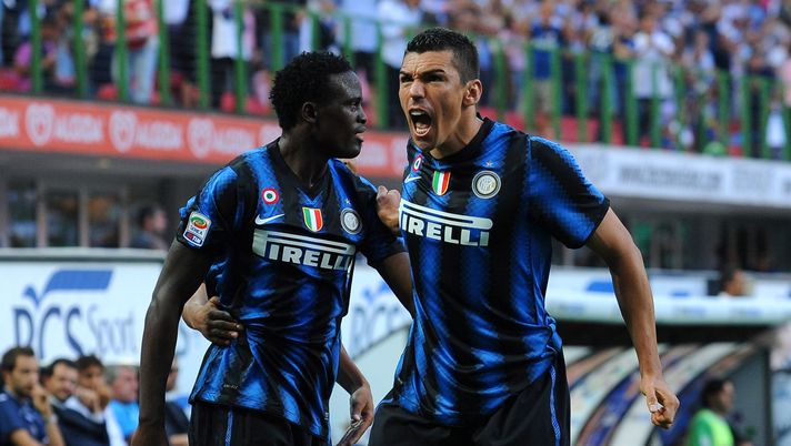 MILAN, ITALY - SEPTEMBER 11:  Lucio (R) of Inter celebrates his goal with team mate Wanyama Mariga during the Serie A match between FC Internazionale and Udinese Calcio at Stadio Giuseppe Meazza on September 11, 2010 in Milan, Italy.  (Photo by Valerio Pennicino/Getty Images) 