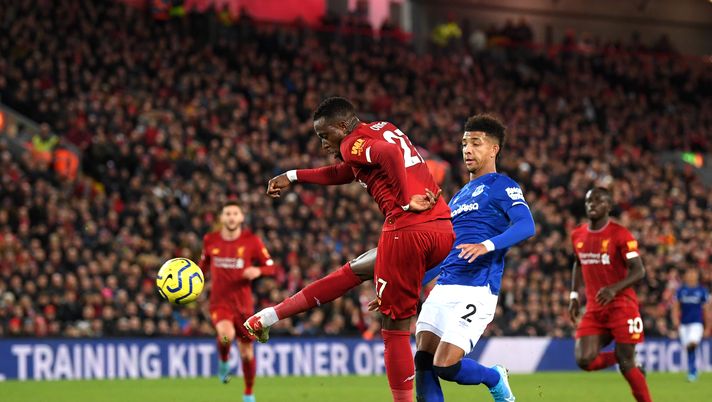 LIVERPOOL, ENGLAND - DECEMBER 04: Divock Origi of Liverpool scores his team's third goal during the Premier League match between Liverpool FC and Everton FC at Anfield on December 04, 2019 in Liverpool, United Kingdom. (Photo by Laurence Griffiths/Getty Images) ORIGI MILAN