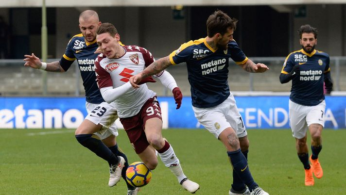 VERONA, ITALY - FEBRUARY 25:  Simone Calvano (L) of Hellas Verona competes with Andrea Bellotti (C) of Torino FC during the serie A match between Hellas Verona FC and Torino FC at Stadio Marc'Antonio Bentegodi on February 25, 2018 in Verona, Italy.  (Photo by Dino Panato/Getty Images)