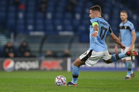 ROME, ITALY - DECEMBER 08: Ciro Immobile of SS Lazio scores their team's second goal from the penalty spot during the UEFA Champions League Group F stage match between SS Lazio and Club Brugge KV at Stadio Olimpico on December 08, 2020 in Rome, Italy. Sporting stadiums around Italy remain under strict restrictions due to the Coronavirus Pandemic as Government social distancing laws prohibit fans inside venues resulting in games being played behind closed doors. (Photo by Paolo Bruno/Getty Images) ROME, ITALY - DECEMBER 08: Ciro Immobile of SS Lazio scores their team's second goal from the penalty spot during the UEFA Champions League Group F stage match between SS Lazio and Club Brugge KV at Stadio Olimpico on December 08, 2020 in Rome, Italy. Sporting stadiums around Italy remain under strict restrictions due to the Coronavirus Pandemic as Government social distancing laws prohibit fans inside venues resulting in games being played behind closed doors. (Photo by Paolo Bruno/Getty Images)