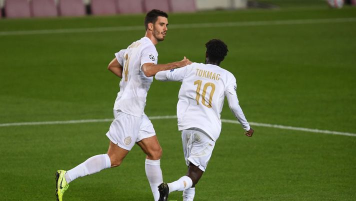 BARCELONA, SPAIN - OCTOBER 20: Ihor Kharatin of Ferencvaros Budapest celebrates with teammate Tokmac Nguen after scoring his sides first goal from the penalty spot during the UEFA Champions League Group G stage match between FC Barcelona and Ferencvaros Budapest at Camp Nou on October 20, 2020 in Barcelona, Spain. Sporting stadiums around Europe remain under strict restrictions due to the Coronavirus Pandemic as Government social distancing laws prohibit fans inside venues resulting in games being played behind closed doors. (Photo by Alex Caparros/Getty Images) BARCELONA, SPAIN - OCTOBER 20: Ihor Kharatin of Ferencvaros Budapest celebrates with teammate Tokmac Nguen after scoring his sides first goal from the penalty spot during the UEFA Champions League Group G stage match between FC Barcelona and Ferencvaros Budapest at Camp Nou on October 20, 2020 in Barcelona, Spain. Sporting stadiums around Europe remain under strict restrictions due to the Coronavirus Pandemic as Government social distancing laws prohibit fans inside venues resulting in games being played behind closed doors. (Photo by Alex Caparros/Getty Images)