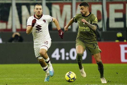MILAN, ITALY - FEBRUARY 10: Rade Krunic of AC Milan competes for the ball with Nikola Vlasic of Torino FC during the Serie A match between AC MIlan and Torino FC at Stadio Giuseppe Meazza on February 10, 2023 in Milan, Italy. (Photo by Pier Marco Tacca/AC Milan via Getty Images)