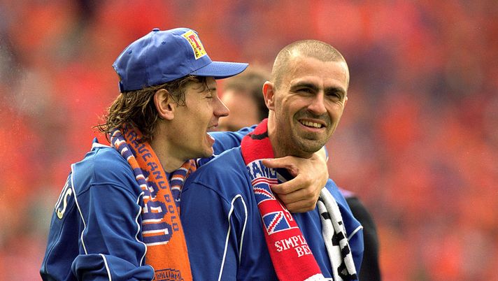 27 May 2000: Rangers players Andrei Kanchelskis with hat on and Sergio Porrini celebrate beating Aberdeen after the Scottish Cup Final at Hampden Park, Scotland. Rangers won 4-0. Mandatory Credit: Jamie McDonald /Allsport 27 May 2000: Rangers players Andrei Kanchelskis with hat on and Sergio Porrini celebrate beating Aberdeen after the Scottish Cup Final at Hampden Park, Scotland. Rangers won 4-0. Mandatory Credit: Jamie McDonald /Allsport