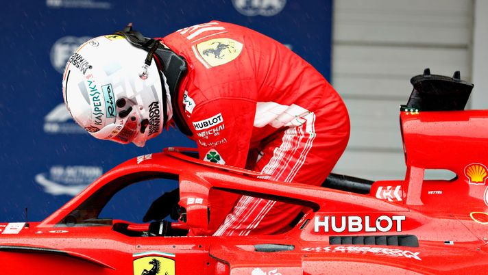 SUZUKA, JAPAN - OCTOBER 06: Sebastian Vettel of Germany and Ferrari climbs from his car in parc ferme after qualifying in 9th place during qualifying for the Formula One Grand Prix of Japan at Suzuka Circuit on October 6, 2018 in Suzuka.  (Photo by Will Taylor-Medhurst/Getty Images) 