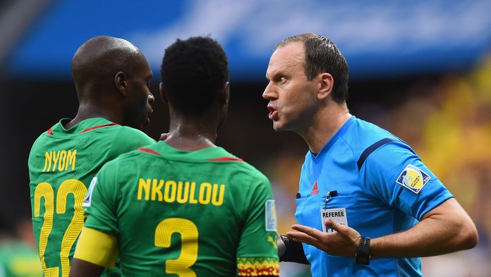 BRASILIA, BRAZIL - JUNE 23: Referee Jonas Eriksson speaks to Allan Nyom (L) and Nicolas N'Koulou of Cameroon during the 2014 FIFA World Cup Brazil Group A match between Cameroon and Brazil at Estadio Nacional on June 23, 2014 in Brasilia, Brazil.  (Photo by Stu Forster/Getty Images) 