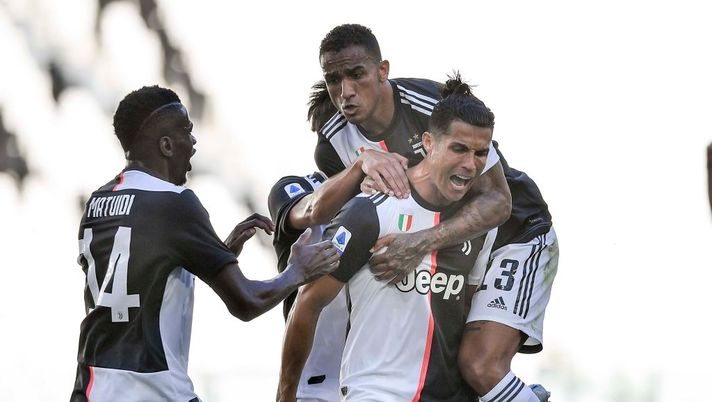 TURIN, ITALY - JULY 04: Cristiano Ronaldo of Juventus celebrates after scoring his team's third goal with teammates Danilo and Blaise Matuidi during the Serie A match between Juventus and Torino FC at Allianz Stadium on July 04, 2020 in Turin, Italy. (Photo by Daniele Badolato - Juventus FC/Juventus FC via Getty Images) TURIN, ITALY - JULY 04: Cristiano Ronaldo of Juventus celebrates after scoring his team's third goal with teammates Danilo and Blaise Matuidi during the Serie A match between Juventus and Torino FC at Allianz Stadium on July 04, 2020 in Turin, Italy. (Photo by Daniele Badolato - Juventus FC/Juventus FC via Getty Images)