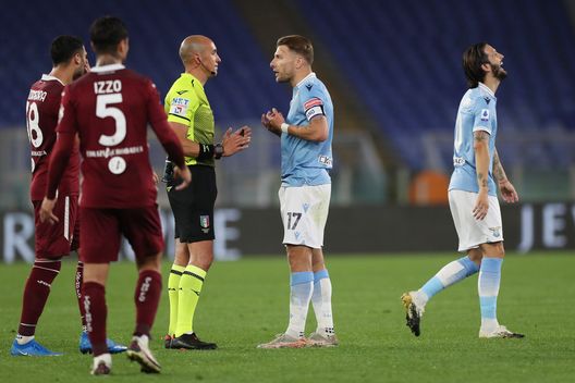 ROME, ITALY - MAY 18: Ciro Immobile of S.S. Lazio interacts with Match Referee Michael Fabbri during the Serie A match between SS Lazio and Torino FC at Stadio Olimpico on May 18, 2021 in Rome, Italy. Sporting stadiums around Italy remain under strict restrictions due to the Coronavirus Pandemic as Government social distancing laws prohibit fans inside venues resulting in games being played behind closed doors. (Photo by Paolo Bruno/Getty Images) ROME, ITALY - MAY 18: Ciro Immobile of S.S. Lazio interacts with Match Referee Michael Fabbri during the Serie A match between SS Lazio and Torino FC at Stadio Olimpico on May 18, 2021 in Rome, Italy. Sporting stadiums around Italy remain under strict restrictions due to the Coronavirus Pandemic as Government social distancing laws prohibit fans inside venues resulting in games being played behind closed doors. (Photo by Paolo Bruno/Getty Images)