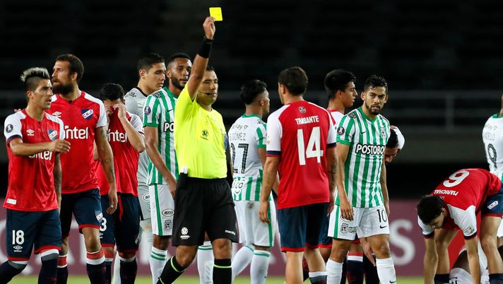 PEREIRA, COLOMBIA - MAY 12: Referee Diego Mirko Haro shows a yellow card to Joaquín Trasante of Nacional during a match between Atletico Nacional and Nacional as part of group F of Copa CONMEBOL Libertadores 2021 at Estadio Hernán Ramírez Villegas on May 12, 2021 in Pereira, Colombia. (Photo by Carlos Ortega - Pool/Getty Images) PEREIRA, COLOMBIA - MAY 12: Referee Diego Mirko Haro shows a yellow card to Joaquín Trasante of Nacional during a match between Atletico Nacional and Nacional as part of group F of Copa CONMEBOL Libertadores 2021 at Estadio Hernán Ramírez Villegas on May 12, 2021 in Pereira, Colombia. (Photo by Carlos Ortega - Pool/Getty Images)