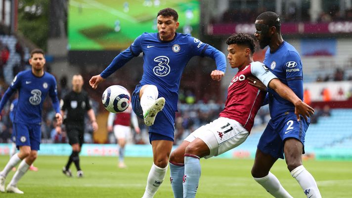 BIRMINGHAM, ENGLAND - MAY 23: Ollie Watkins of Aston Villa battles for possession with Thiago Silva (l) and Antonio Rudiger (r) of Chelsea during the Premier League match between Aston Villa and Chelsea at Villa Park on May 23, 2021 in Birmingham, England. A limited number of fans will be allowed into Premier League stadiums as Coronavirus restrictions begin to ease in the UK following the COVID-19 pandemic. (Photo by Michael Steele/Getty Images) BIRMINGHAM, ENGLAND - MAY 23: Ollie Watkins of Aston Villa battles for possession with Thiago Silva (l) and Antonio Rudiger (r) of Chelsea during the Premier League match between Aston Villa and Chelsea at Villa Park on May 23, 2021 in Birmingham, England. A limited number of fans will be allowed into Premier League stadiums as Coronavirus restrictions begin to ease in the UK following the COVID-19 pandemic. (Photo by Michael Steele/Getty Images)