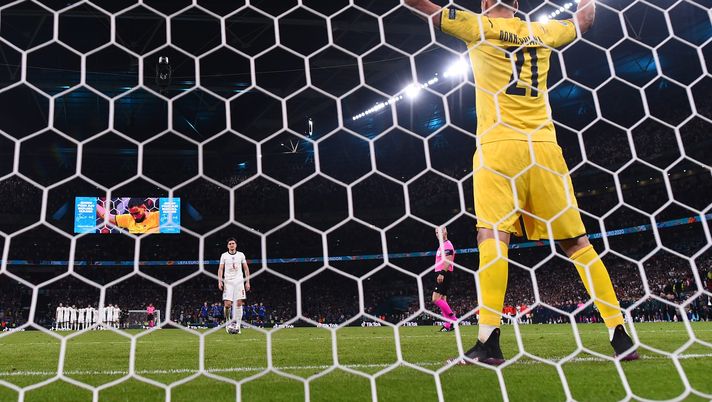 LONDON, ENGLAND - JULY 11: Harry Maguire of England walks up to take his penalty as in a penalty shoot out as Gianluigi Donnarumma of Italy looks on during the UEFA Euro 2020 Championship Final between Italy and England at Wembley Stadium on July 11, 2021 in London, England. (Photo by Laurence Griffiths/Getty Images) LONDON, ENGLAND - JULY 11: Harry Maguire of England walks up to take his penalty as in a penalty shoot out as Gianluigi Donnarumma of Italy looks on during the UEFA Euro 2020 Championship Final between Italy and England at Wembley Stadium on July 11, 2021 in London, England. (Photo by Laurence Griffiths/Getty Images)