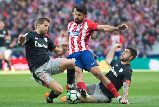 MADRID, SPAIN - FEBRUARY 18: Diego Costa of Atletico Madrid is tackled by Inigo Martinez (left) and Unai Nunez of Athletic Club during the La Liga match between Atletico Madrid and Athletic Club at estadio Wanda Metropolitano on February 18, 2018 in Madrid, Spain. (Photo by Denis Doyle/Getty Images) MADRID, SPAIN - FEBRUARY 18: Diego Costa of Atletico Madrid is tackled by Inigo Martinez (left) and Unai Nunez of Athletic Club during the La Liga match between Atletico Madrid and Athletic Club at estadio Wanda Metropolitano on February 18, 2018 in Madrid, Spain. (Photo by Denis Doyle/Getty Images)