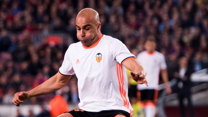 BARCELONA, SPAIN - MARCH 19:  Lionel Messi (L) of FC Barcelona dribbles Aymen Abdennour of Valencia CF before scoring his team's third goal during the La Liga match between FC Barcelona and Valencia CF at Camp Nou stadium on March 19, 2017 in Barcelona, Spain.  (Photo by Alex Caparros/Getty Images) 