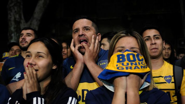 BUENOS AIRES, ARGENTINA - OCTOBER 22: Fans of the Boca Juniors soccer team watch a tense match in Buenos Aires on October 22, 2019 in Buenos Aires, Argentina. Boca Juniors ultimately lost the match to River Plate 2-1. Argentina, a nation rocked by boom and bust economies for decades, is preparing for new presidential elections next Sunday which will see populist-leaning Alberto Fernandez against business-friendly incumbent Mauricio Macri. With a sharp drop in the peso, high unemployment and rising inflation, Argentines are looking for a leader to steer the economy towards stabilization.  (Photo by Spencer Platt/Getty Images) 