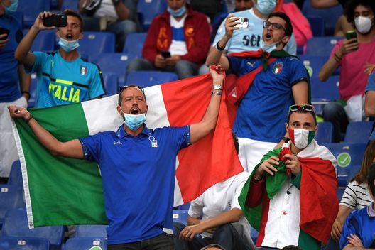 ROME, ITALY - JUNE 11: Italy fans show their support prior to the UEFA Euro 2020 Championship Group A match between Turkey and Italy at the Stadio Olimpico on June 11, 2021 in Rome, Italy. (Photo by Alberto Lingria - Pool/Getty Images) ROME, ITALY - JUNE 11: Italy fans show their support prior to the UEFA Euro 2020 Championship Group A match between Turkey and Italy at the Stadio Olimpico on June 11, 2021 in Rome, Italy. (Photo by Alberto Lingria - Pool/Getty Images)