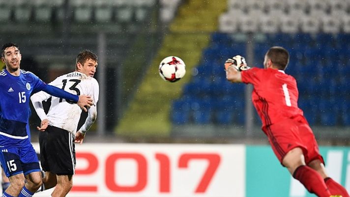 German forward Thomas Mueller (2ndL) heads the ball during the World Cup 2018 qualifying soccer match San Marino vs Germany at the San Marino stadium in Serravalle on November 11, 2016. / AFP / VINCENZO PINTO        (Photo credit should read VINCENZO PINTO/AFP/Getty Images) 