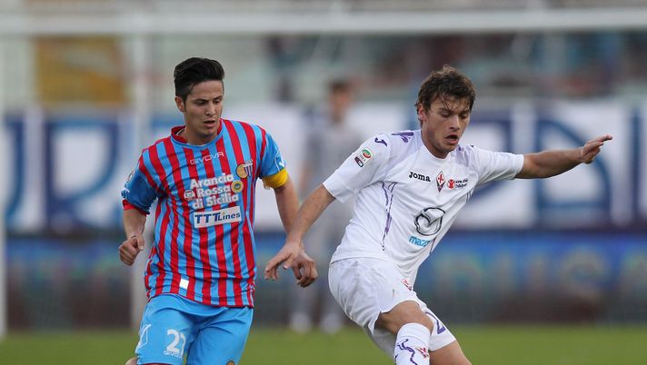 CATANIA, ITALY - JANUARY 27: Marco Biagianti (L) competes for the ball with Adem Ljajic of Fiorentina during the Serie A match between Calcio Catania and ACF Fiorentina at Stadio Angelo Massimino on January 27, 2013 in Catania, Italy. (Photo by Maurizio Lagana/Getty Images) CATANIA, ITALY - JANUARY 27: Marco Biagianti (L) competes for the ball with Adem Ljajic of Fiorentina during the Serie A match between Calcio Catania and ACF Fiorentina at Stadio Angelo Massimino on January 27, 2013 in Catania, Italy. (Photo by Maurizio Lagana/Getty Images)