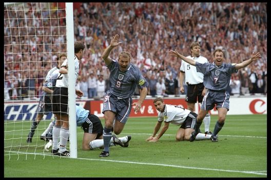 26 Jun 1996: Alan Shearer (number 9) scores for England during the European championship semi final match between England and Germany at Wembley Stadium, London. Germany won the match after extra time in a penalty shoot out 1(6) 1(5). Mandatory Credit:Ross Kinnaird/Allsport UK 26 Jun 1996: Alan Shearer (number 9) scores for England during the European championship semi final match between England and Germany at Wembley Stadium, London. Germany won the match after extra time in a penalty shoot out 1(6) 1(5). Mandatory Credit:Ross Kinnaird/Allsport UK