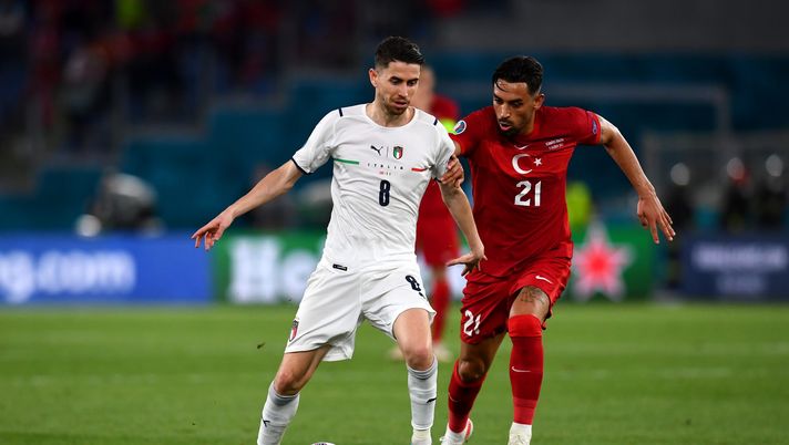 ROME, ITALY - JUNE 11: Jorginho of Italy is closed down by Irfan Can Kahveci of Turkey during the UEFA Euro 2020 Championship Group A match between Turkey and Italy at the Stadio Olimpico on June 11, 2021 in Rome, Italy. (Photo by Claudio Villa/Getty Images) 