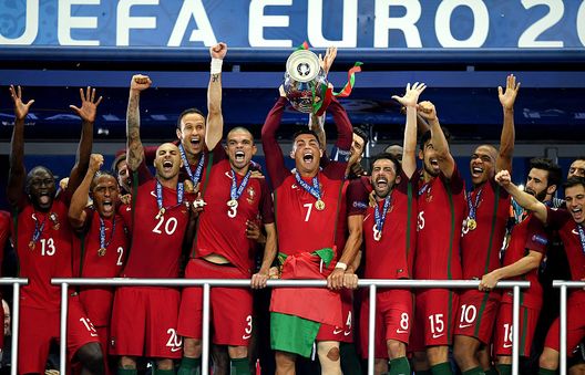 PARIS, FRANCE - JULY 10: Cristiano Ronaldo of Portugal (c) lifts the Henri Delaunay trophy after his side win 1-0 against France during the UEFA EURO 2016 Final match between Portugal and France at Stade de France on July 10, 2016 in Paris, France. (Photo by Matthias Hangst/Getty Images) PARIS, FRANCE - JULY 10: Cristiano Ronaldo of Portugal (c) lifts the Henri Delaunay trophy after his side win 1-0 against France during the UEFA EURO 2016 Final match between Portugal and France at Stade de France on July 10, 2016 in Paris, France. (Photo by Matthias Hangst/Getty Images)