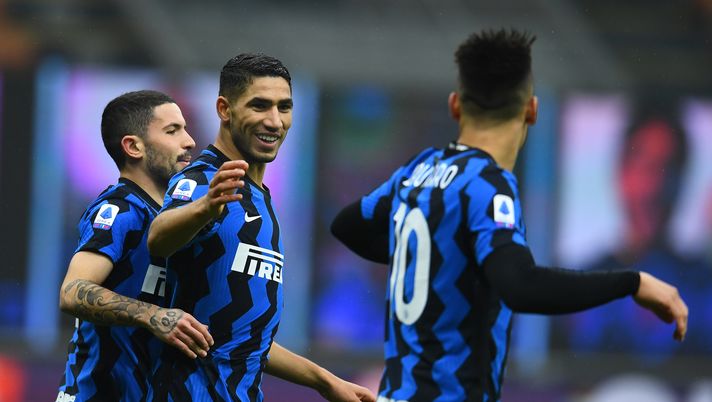 MILAN, ITALY - DECEMBER 20: Achraf Hakimi of FC Internazionale celebrates with Lautaro Martinez and Stefano Sensi after scoring the opening goal during the Serie A match between FC Internazionale and Spezia Calcio at Stadio Giuseppe Meazza on December 20, 2020 in Milan, Italy. Sporting stadiums around Italy remain under strict restrictions due to the Coronavirus Pandemic as Government social distancing laws prohibit fans inside venues resulting in games being played behind closed doors. (Photo by Claudio Villa - Inter/Inter via Getty Images) MILAN, ITALY - DECEMBER 20: Achraf Hakimi of FC Internazionale celebrates with Lautaro Martinez and Stefano Sensi after scoring the opening goal during the Serie A match between FC Internazionale and Spezia Calcio at Stadio Giuseppe Meazza on December 20, 2020 in Milan, Italy. Sporting stadiums around Italy remain under strict restrictions due to the Coronavirus Pandemic as Government social distancing laws prohibit fans inside venues resulting in games being played behind closed doors. (Photo by Claudio Villa - Inter/Inter via Getty Images)