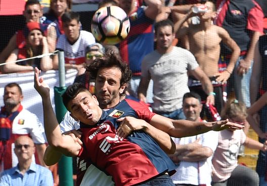 GENOA, ITALY - MAY 21: Emiliano Moretti of FC Torino and Giovanni Simeone of Genoa CFC during the Serie A match between Genoa CFC and FC Torino at Stadio Luigi Ferraris on May 21, 2017 in Genoa, Italy. (Photo by Paolo Rattini/Getty Images) GENOA, ITALY - MAY 21: Emiliano Moretti of FC Torino and Giovanni Simeone of Genoa CFC during the Serie A match between Genoa CFC and FC Torino at Stadio Luigi Ferraris on May 21, 2017 in Genoa, Italy. (Photo by Paolo Rattini/Getty Images)
