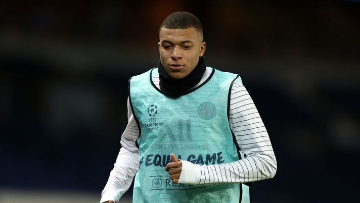 PARIS, FRANCE - MARCH 11: (FREE FOR EDITORIAL USE) In this handout image provided by UEFA, Kylian Mbappe of Paris Saint-Germain warms up during the UEFA Champions League round of 16 second leg match between Paris Saint-Germain and Borussia Dortmund at Parc des Princes on March 11, 2020 in Paris, France. The match is played behind closed doors as a precaution against the spread of COVID-19 (Coronavirus).  (Photo by UEFA - Handout/UEFA via Getty Images) 