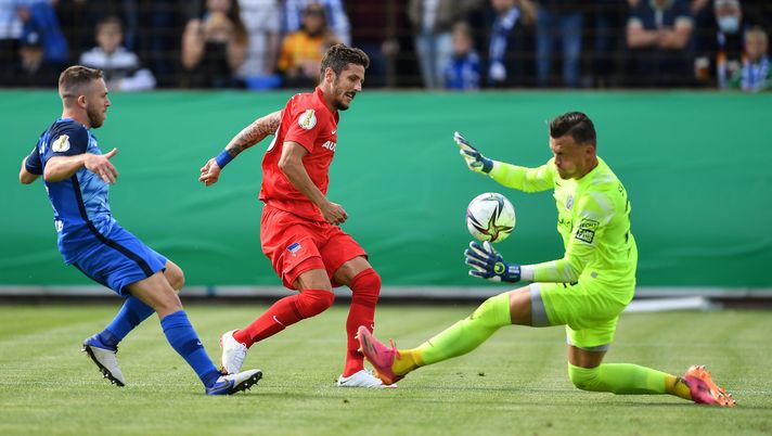 MEPPEN, GERMANY - AUGUST 08: Berlins Stevan Jovetic challenges Meppens Markus Ballmert and Meppens Eric Domanschke during the DFB Cup first round match between SV Meppen and Hertha BSC on August 08, 2021 in Meppen, Germany. (Photo by Frederic Scheidemann/Getty Images) 