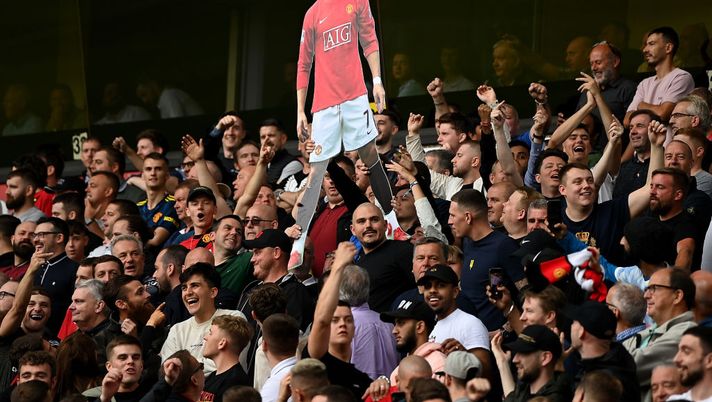 WOLVERHAMPTON, ENGLAND - AUGUST 29: Fans of Manchester United hold up a cardboard cutout of New Signing Cristiano Ronaldo during the Premier League match between Wolverhampton Wanderers and Manchester United at Molineux on August 29, 2021 in Wolverhampton, England. (Photo by Shaun Botterill/Getty Images) WOLVERHAMPTON, ENGLAND - AUGUST 29: Fans of Manchester United hold up a cardboard cutout of New Signing Cristiano Ronaldo during the Premier League match between Wolverhampton Wanderers and Manchester United at Molineux on August 29, 2021 in Wolverhampton, England. (Photo by Shaun Botterill/Getty Images)