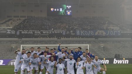 STOCKHOLM, SWEDEN - MARCH 16: Players from Lech Poznan celebrate in front of their traveling supporters the UEFA Europa Conference League round of 16 leg two match between Djurgardens IF and Lech Poznan at Tele2 Arena on March 16, 2023 in Stockholm, Sweden. (Photo by Michael Campanella/Getty Images)