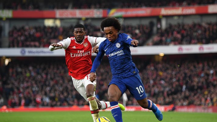 LONDON, ENGLAND - DECEMBER 29: Willian of Chelsea breaks away from Ainsley Maitland-Niles of Arsenal during the Premier League match between Arsenal FC and Chelsea FC at Emirates Stadium on December 29, 2019 in London, United Kingdom. (Photo by Shaun Botterill/Getty Images) LONDON, ENGLAND - DECEMBER 29: Willian of Chelsea breaks away from Ainsley Maitland-Niles of Arsenal during the Premier League match between Arsenal FC and Chelsea FC at Emirates Stadium on December 29, 2019 in London, United Kingdom. (Photo by Shaun Botterill/Getty Images)